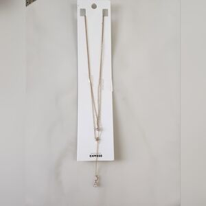 Express Gold Tone Layered Necklace. Crystal pendents